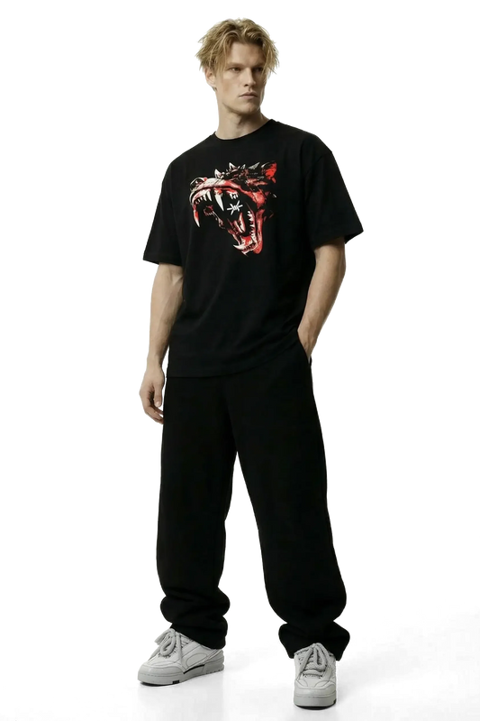 Ominous Dog Heavyweight Tee - Person wearing a black t-shirt with a graphic design on a white background
