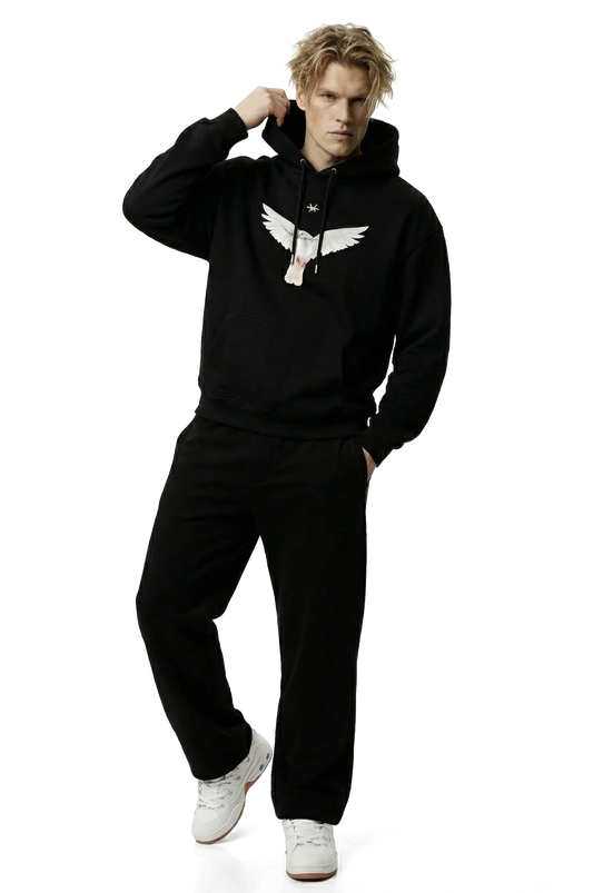 Person wearing a black hoodie with a white dove logo on a white background