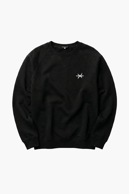 Black sweatshirt with a small white logo on a white background