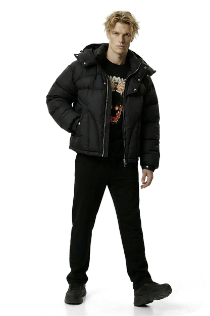 Man wearing a black puffer jacket and black pants on a transparent background