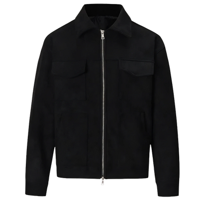 A black suede lounge overshirt with a lapel collar, full-length metal zipper, and double-ended sliders. It features square, buttoned pockets on the chest and a split lower pocket.