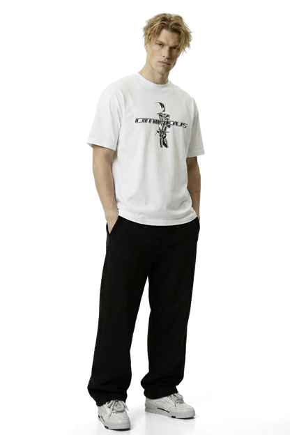 Ominous chrome silver girl heavyweight oversized tee - Man wearing a white t-shirt with a logo and text, black pants, and gray shoes on a white background