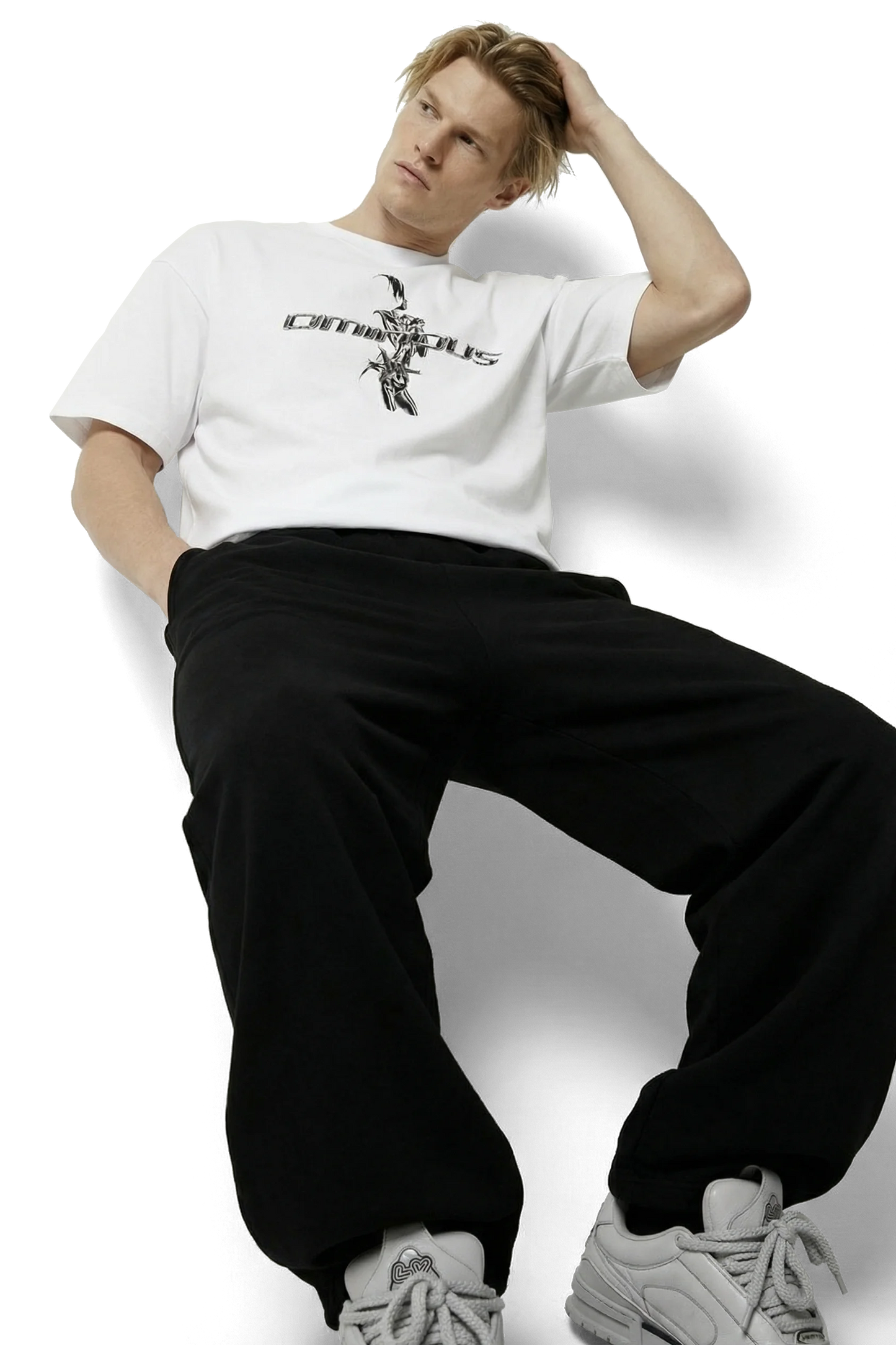 Ominous chrome silver girl heavyweight oversized tee - Person wearing a white t-shirt with text and black pants on a white background