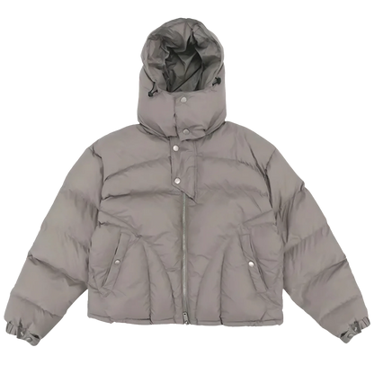 Ominous Angular v-taper puffer jacket in concrete gray khaki with a hood, featuring split joey pockets, metal zipper, and button popper adjustable cuffs.