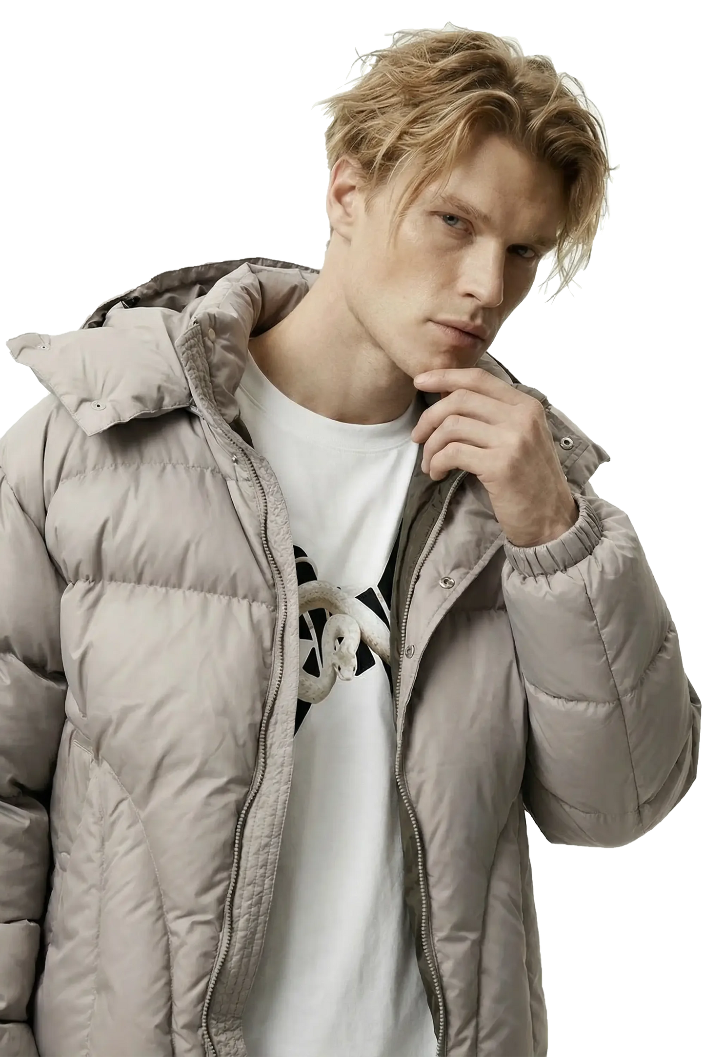 Man wearing a light gray puffer jacket over a white shirt with a black 'Ominous' logo design.
