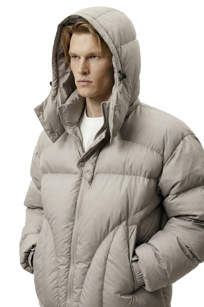 Man wearing a gray puffer jacket on a transparent background
