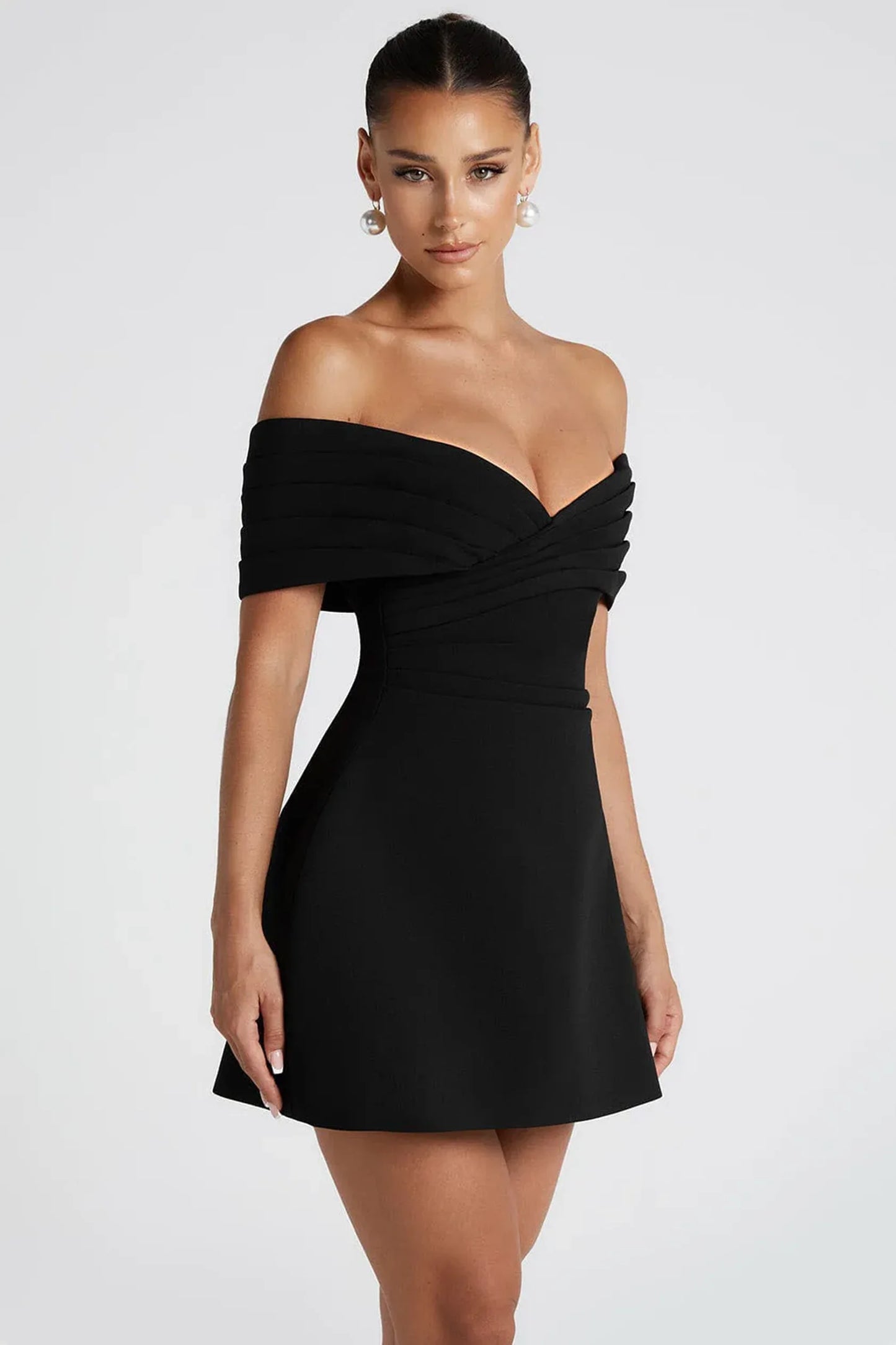 Ella mini dress - Black off-shoulder dress worn by a model on a white background front side model shot