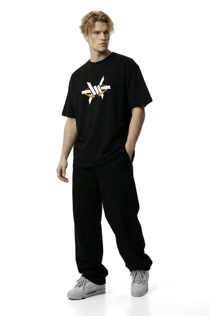 Ominous Fireball Heavyweight Oversized Tee - Man wearing a black t-shirt with a logo on a white background