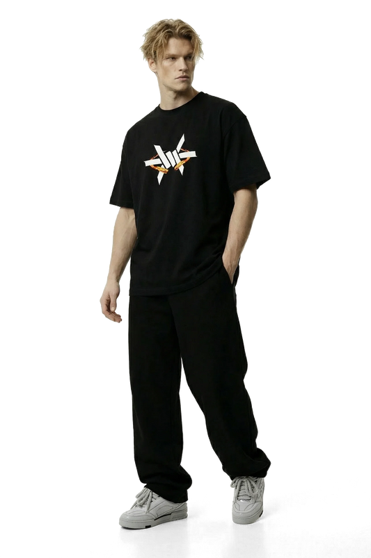 Ominous Fireball Heavyweight Oversized Tee - Man wearing a black t-shirt with a logo on a white background