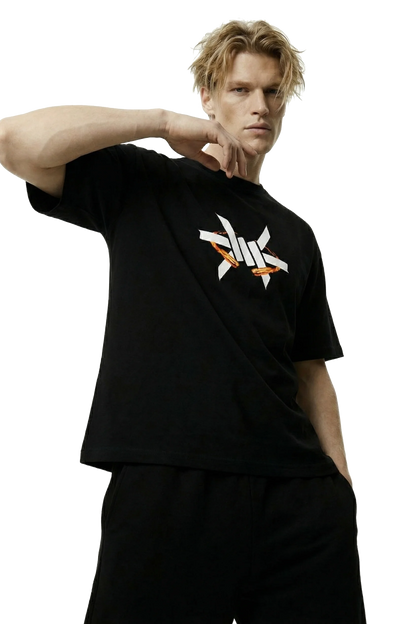 Ominous Fireball Heavyweight Oversized Tee - Man wearing a black t-shirt with a logo on a white background