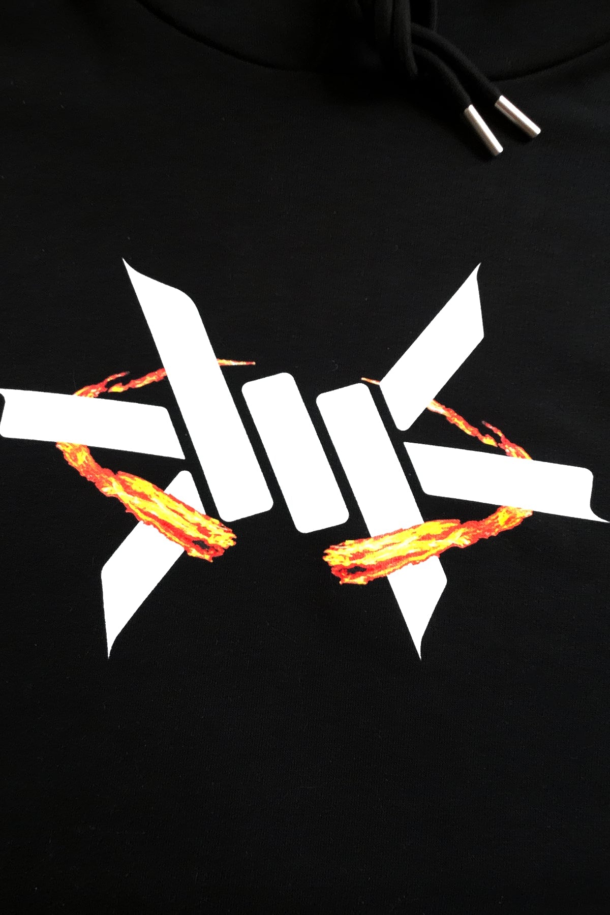 Black hoodie with a white logo featuring flames on a black background
