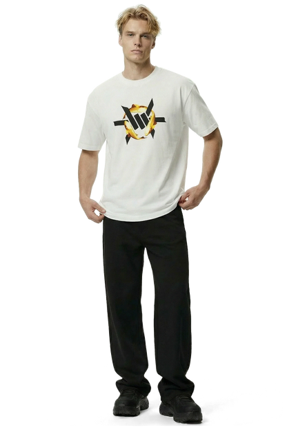 Golden Koi Heavyweight Tee - Man wearing a white t-shirt with a black and yellow koi fish logo and black pants on a white background