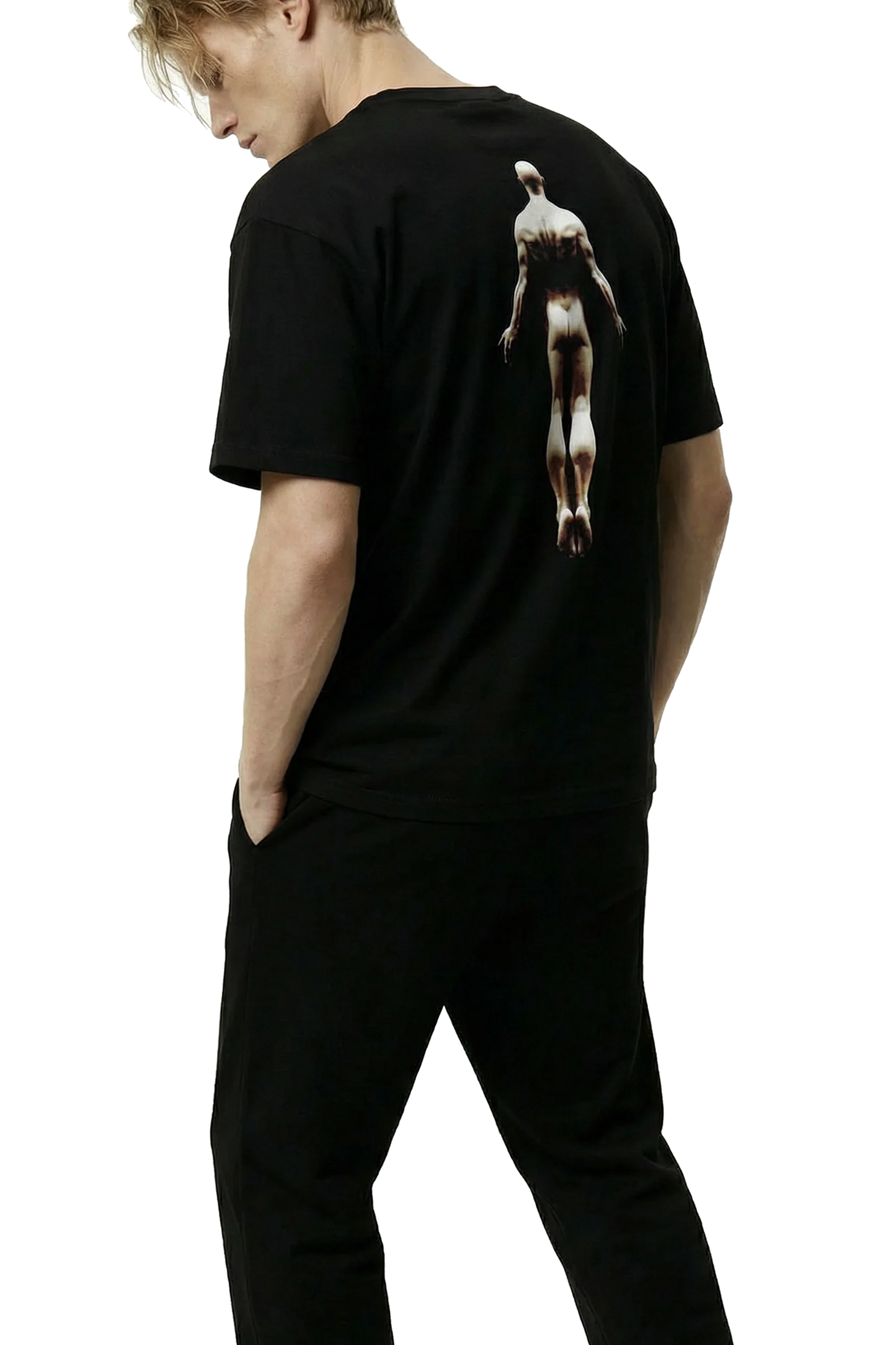 Ominous Ascendance Heavyweight Tee - Man wearing a black t-shirt with a floating male figure graphic design on the back, standing against a white background.