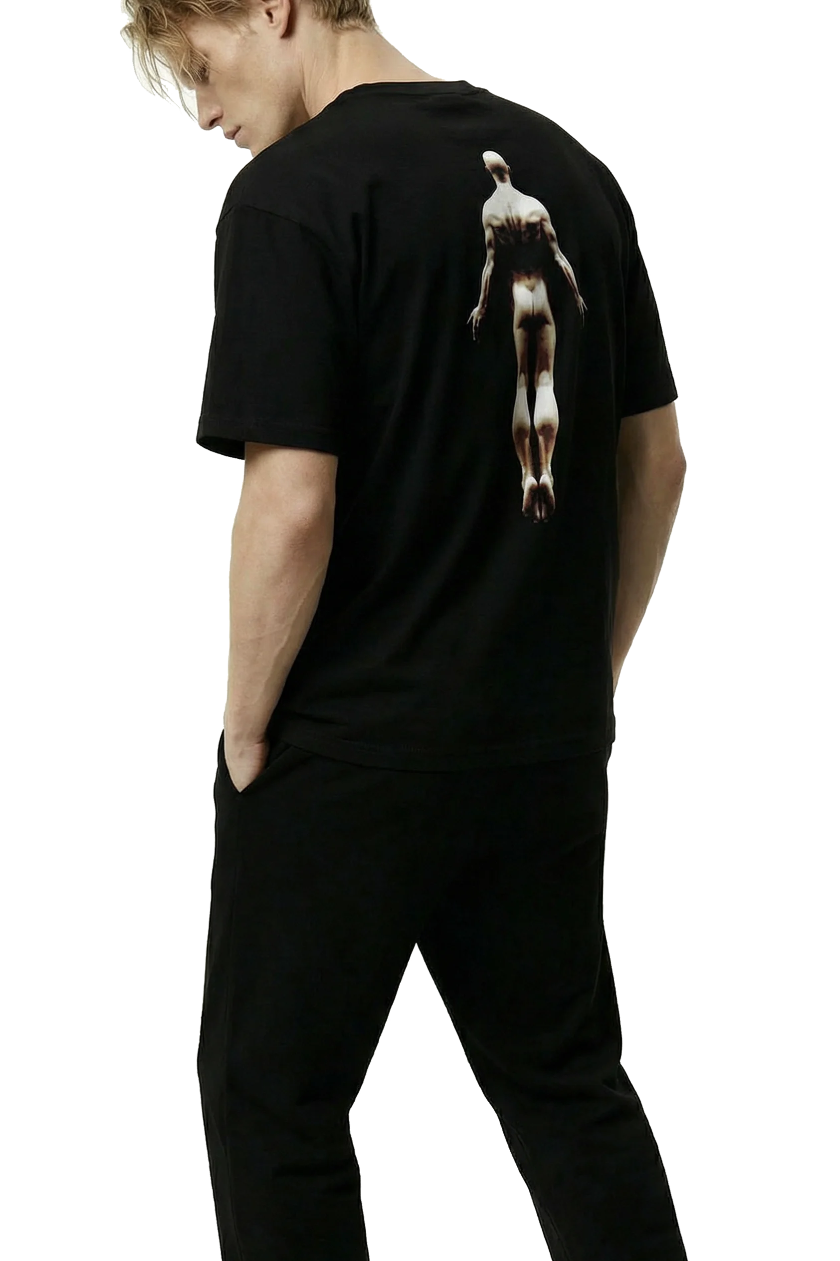 Ominous Ascendance Heavyweight Tee - Man wearing a black t-shirt with a floating male figure graphic design on the back, standing against a white background.