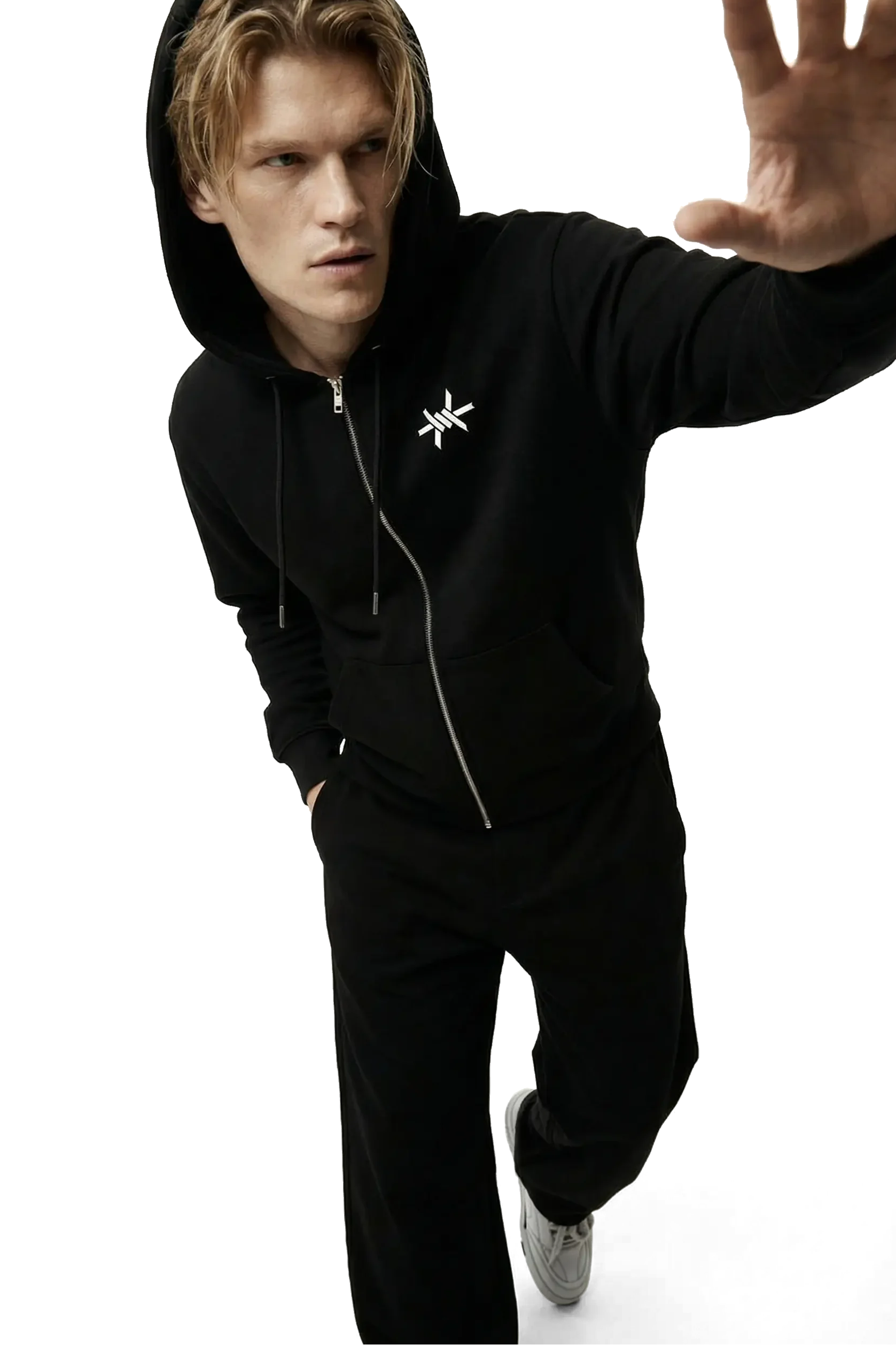 Person wearing a black hoodie with a star 'Ominous' barbed wire logo on a white background
