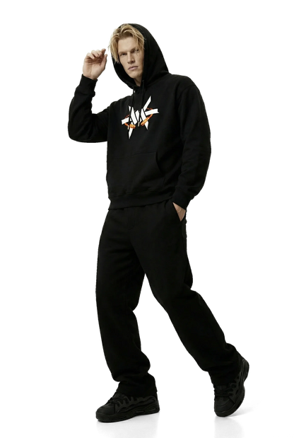 Person wearing a black hoodie with a white logo on a white background