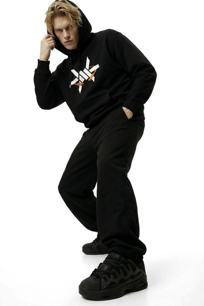 Person wearing a black hoodie with a white large 'Ominous' brand logo on a white background