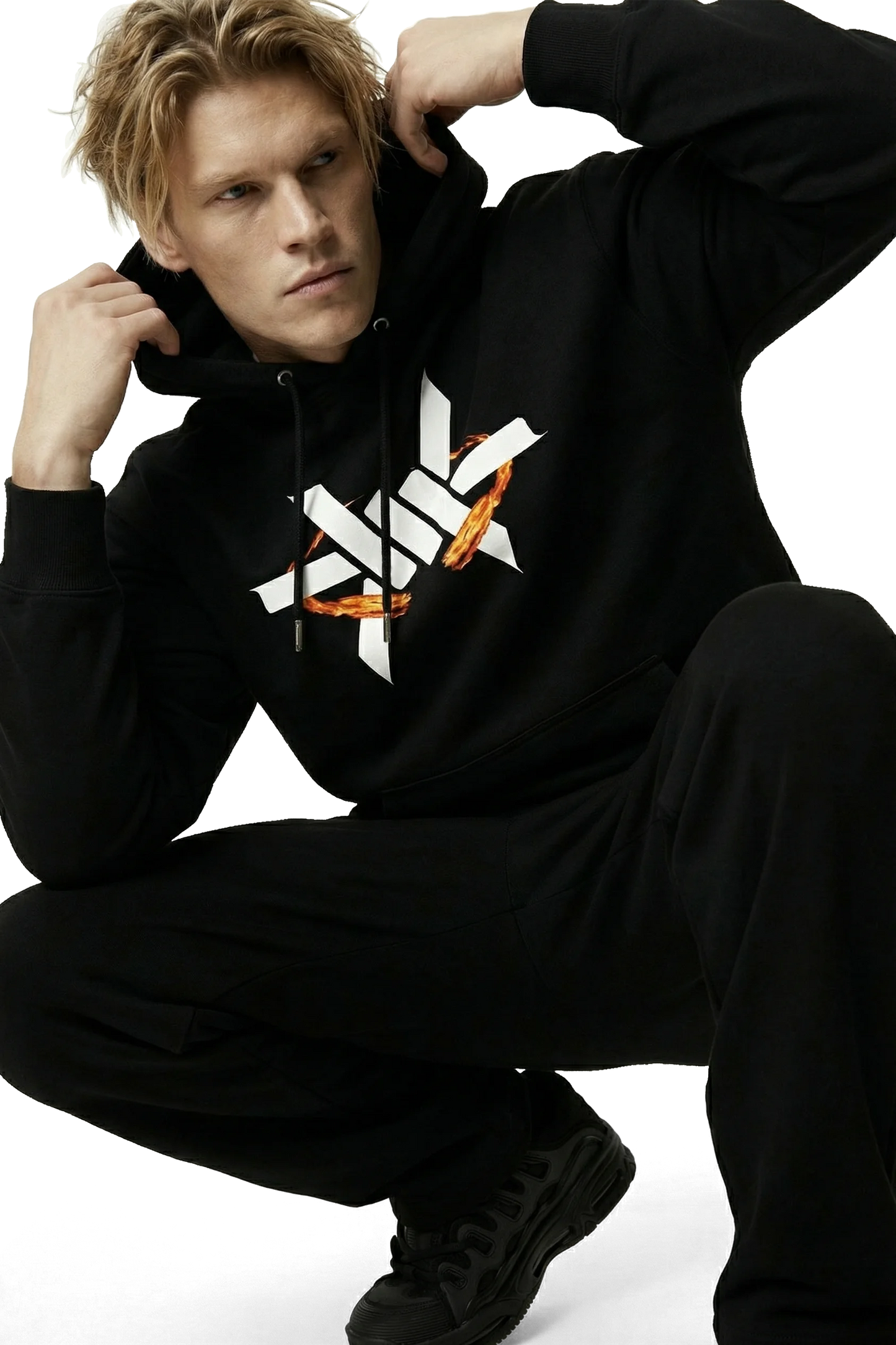 Person wearing a black hoodie with a logo on a white background