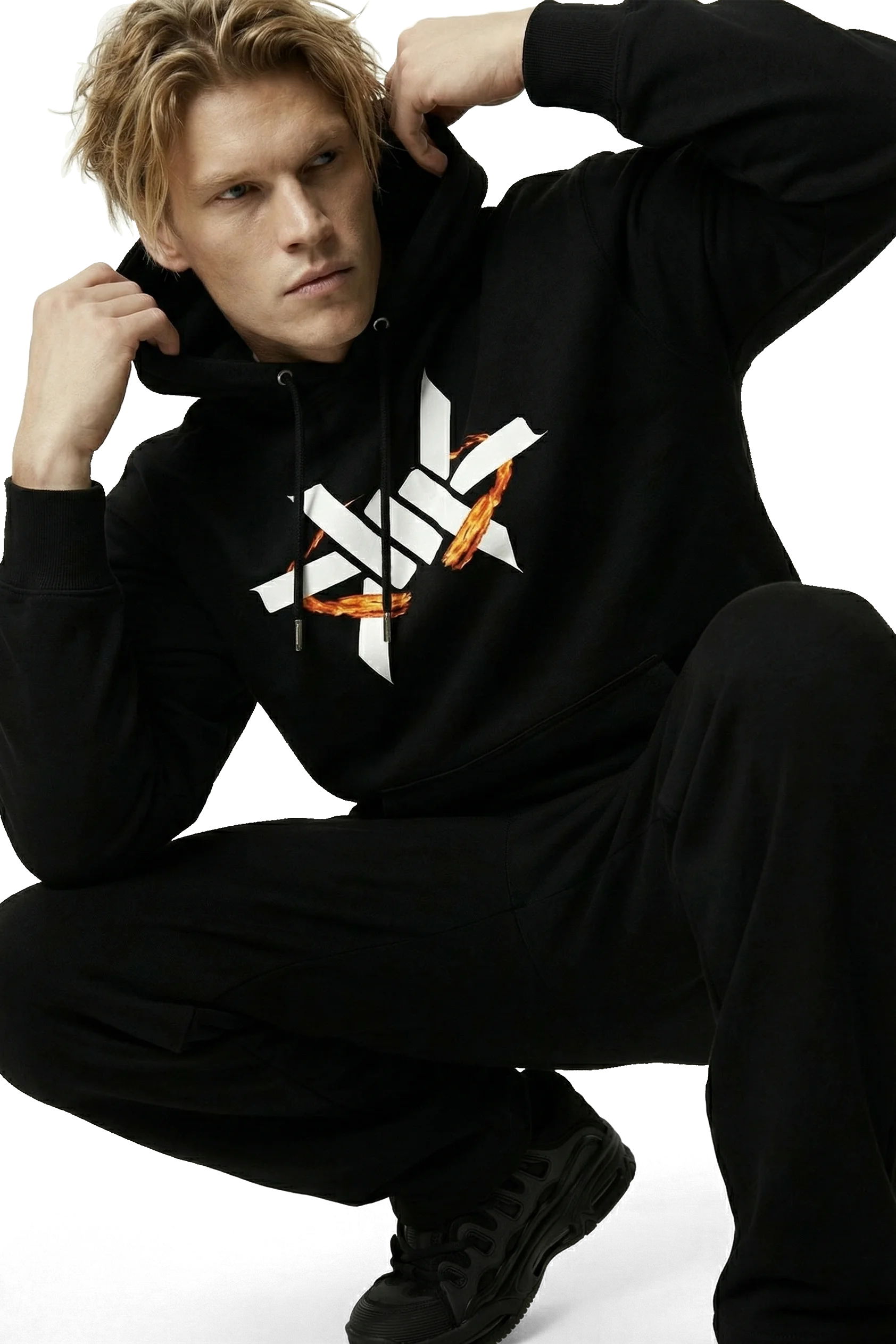 Person wearing a black hoodie with a logo on a white background