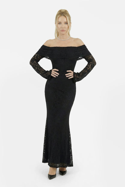 Shadow Maxi Lace Dress - Woman wearing a black long sleeve lace off-shoulder dress on a white background