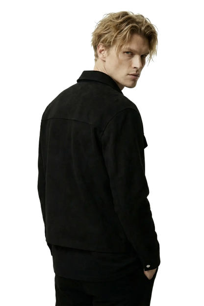 Person wearing a black suede lounge overshirt jacket on a white background