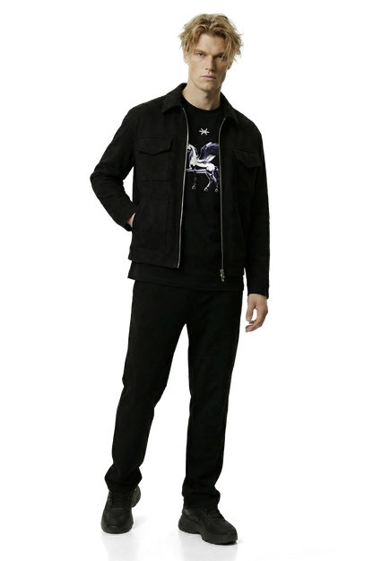 Man wearing a black suede lounge overshirt and pants with a graphic shirt on a white background