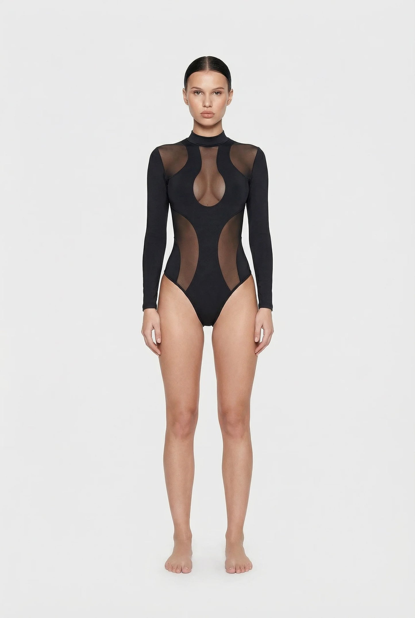 ominous-black sheer bodysuit worn by a model on a white background