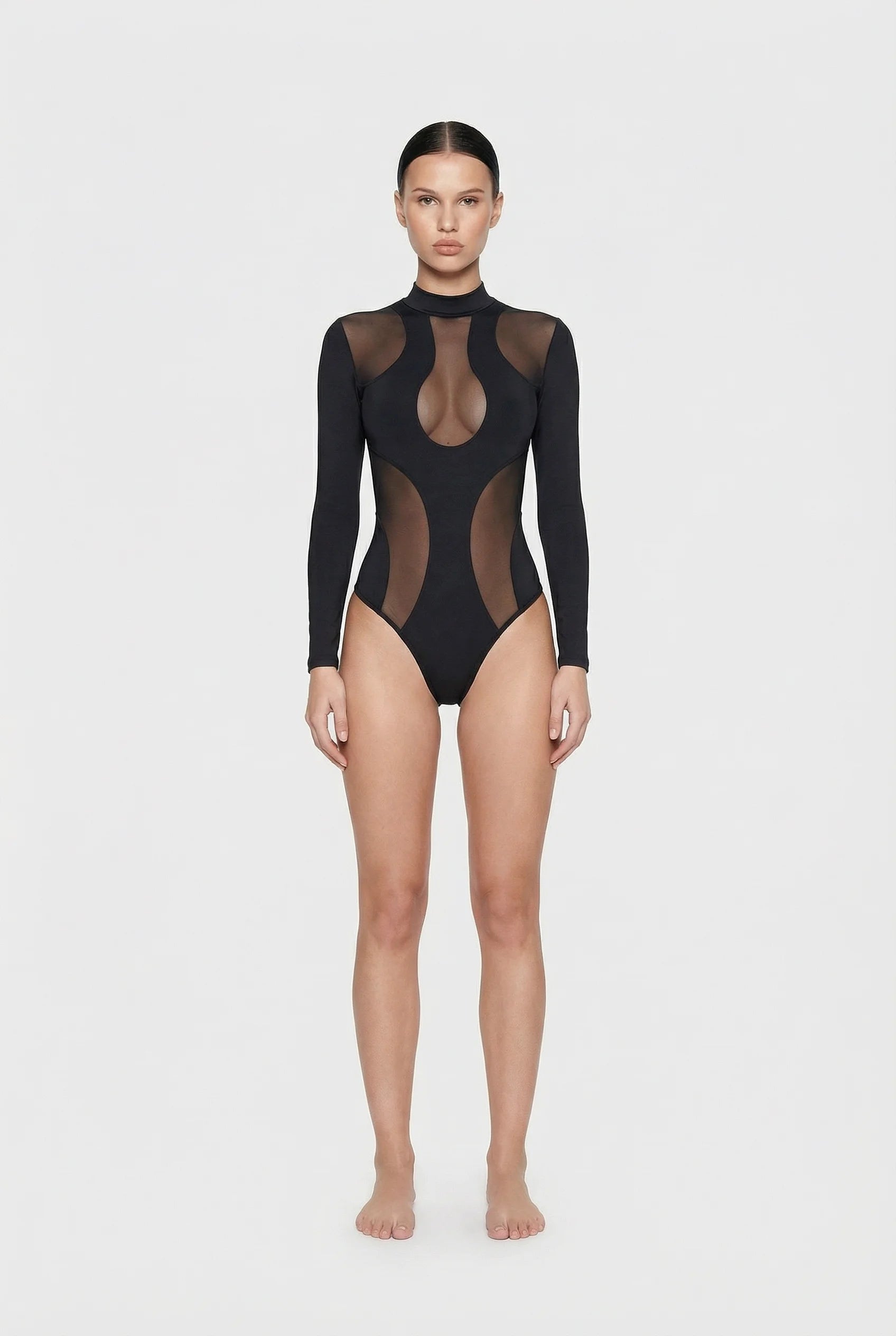 ominous-black sheer bodysuit worn by a model on a white background