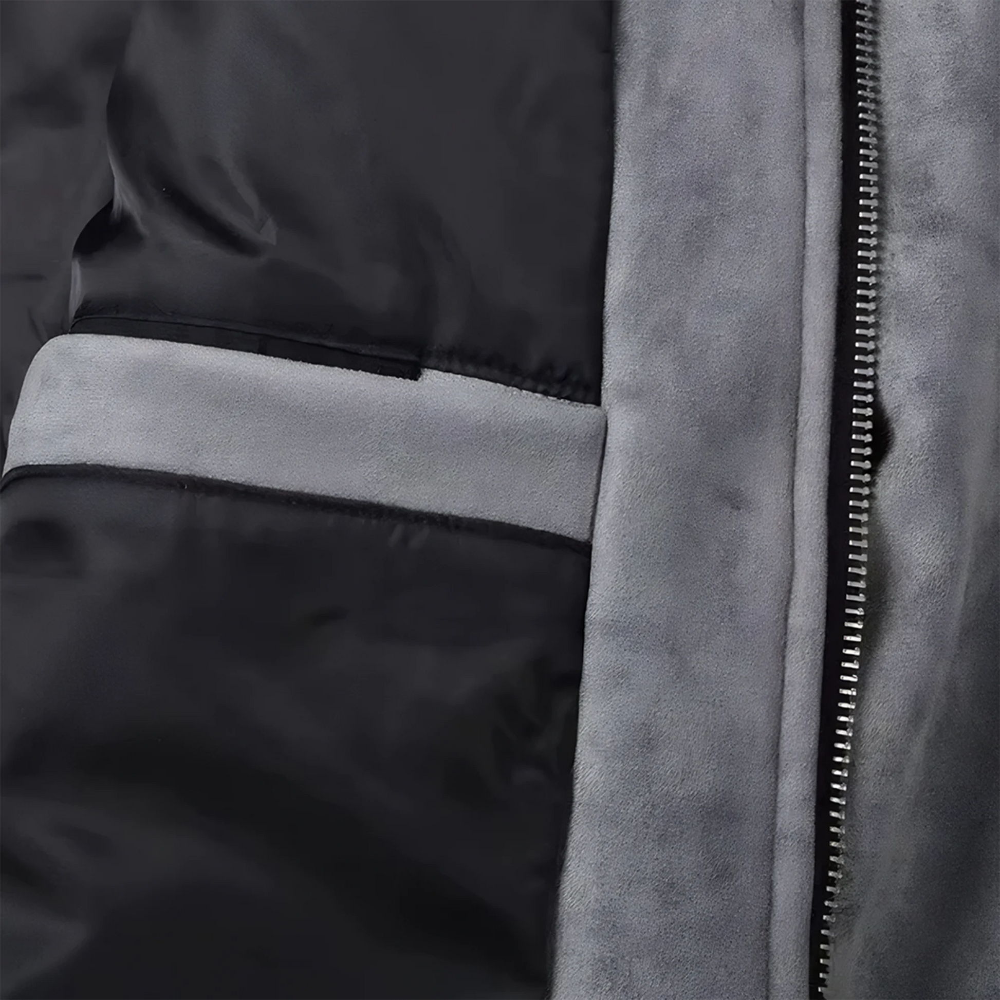 Close up of the inside of a gray suede lounge mens overshirt jacket showing suede, metal zipper and black silk inner