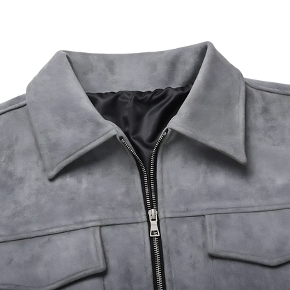 Close up of a grey suede lounge overshirt jacket lapel collar and metal front zipper with top buttoned pockets on either side